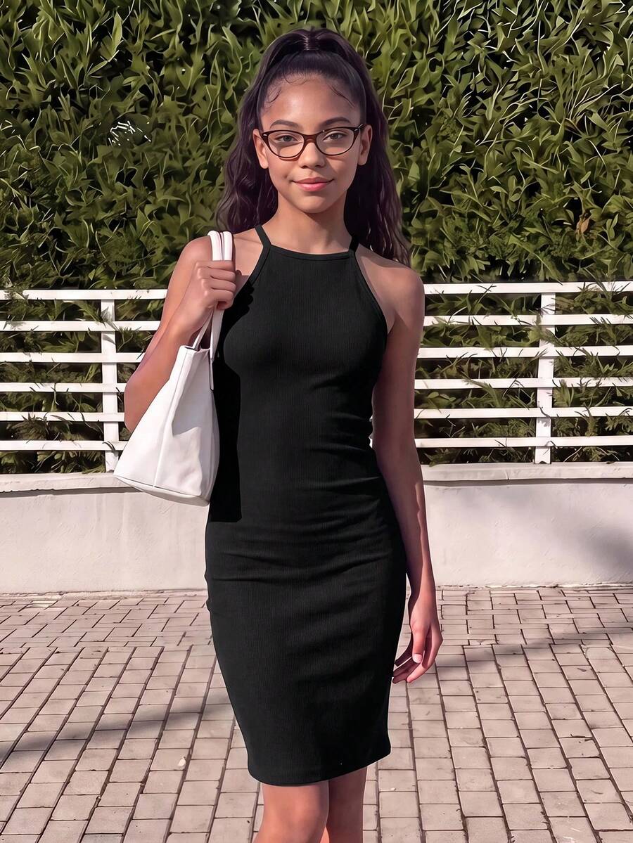 Tween girl black mini dress with halter neckline, backless design, tiered layer detail, high waist, flounce hem, and sleeveless slim fit.