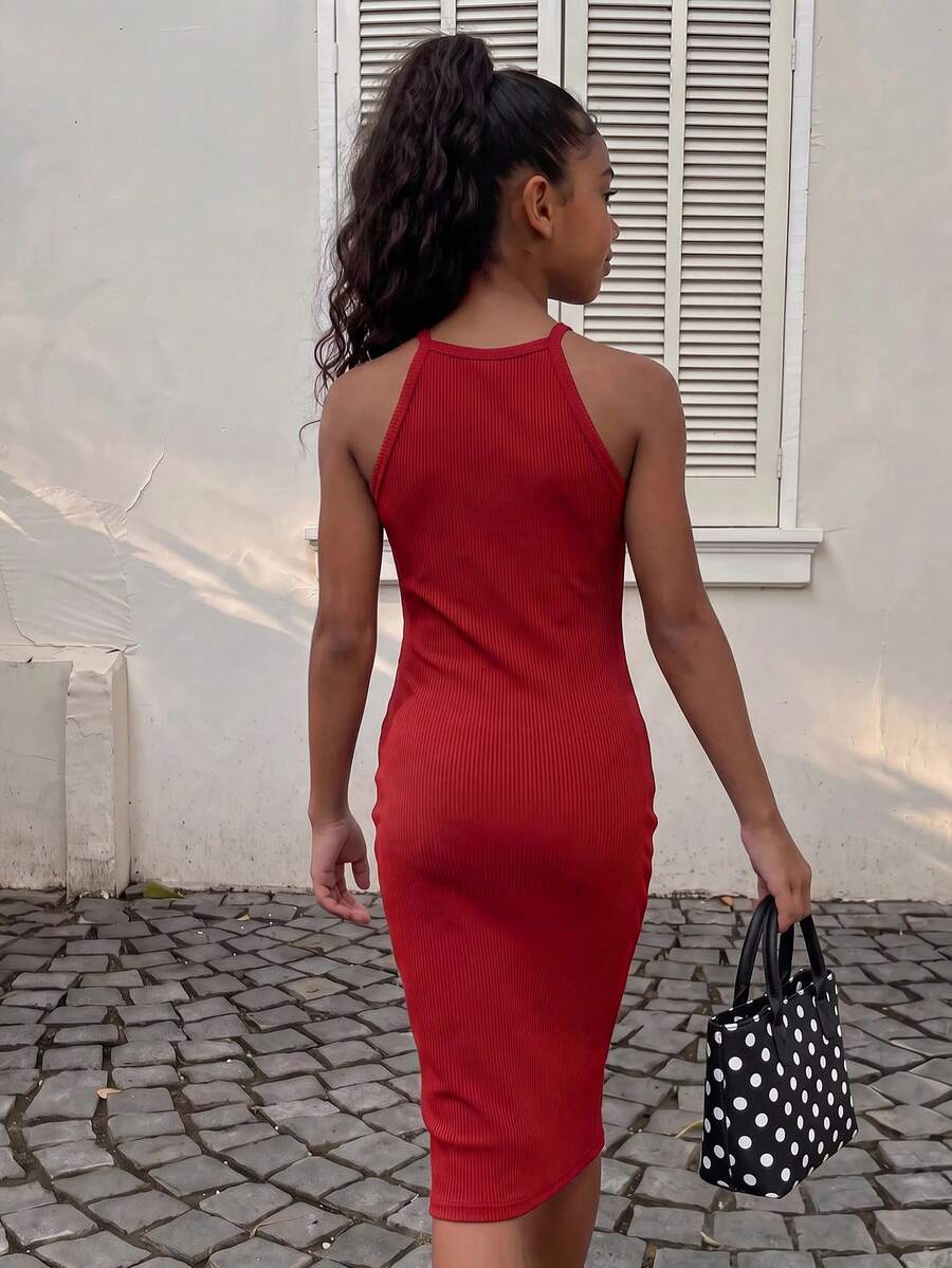 Tween girl black mini dress with halter neckline, backless design, tiered layer detail, high waist, flounce hem, and sleeveless slim fit.