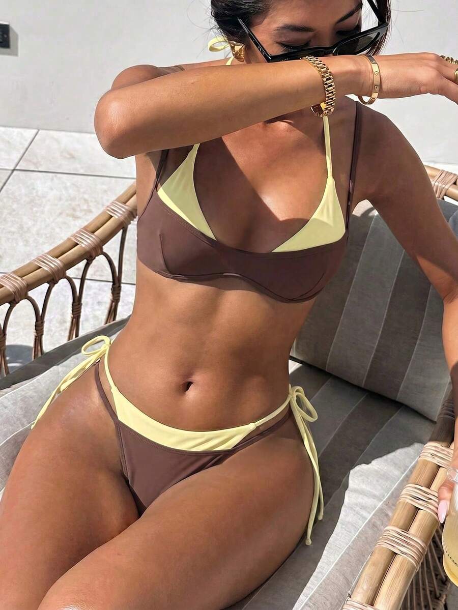 Women's retro polka dot high waist bikini swimsuit set with spaghetti straps and knot tie-back top.