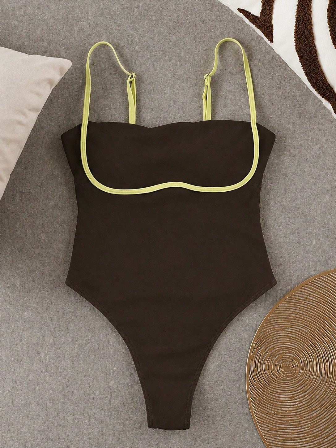 Black colorblock women's one-piece swimsuit with spaghetti straps and high stretch fabric.