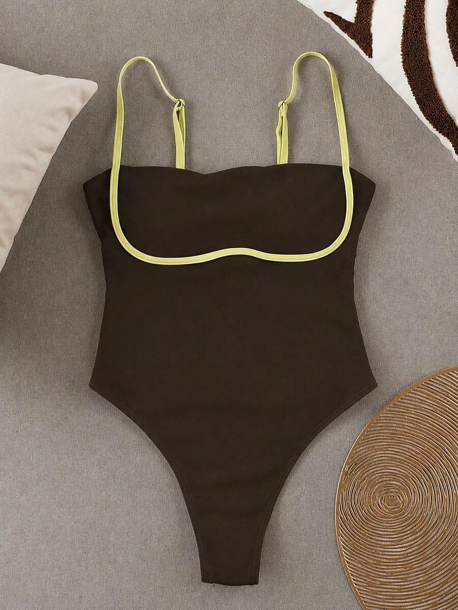 Black colorblock women's one-piece swimsuit with spaghetti straps and high stretch fabric.