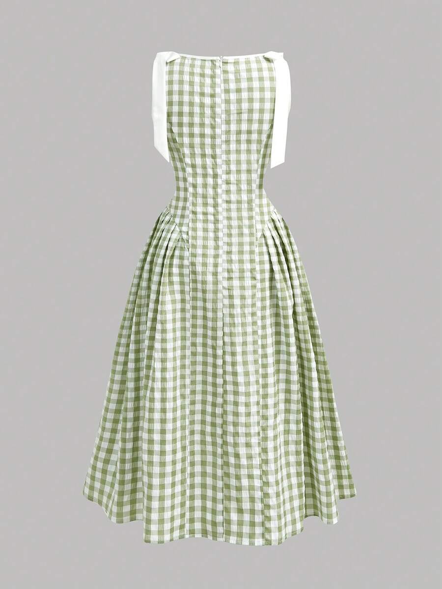Tween girl green plaid modest sleeveless long dress featuring a round neckline, high waist, and flared A-line hem.