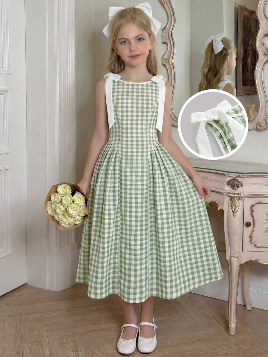 Tween girl green plaid modest sleeveless long dress featuring a round neckline, high waist, and flared A-line hem.