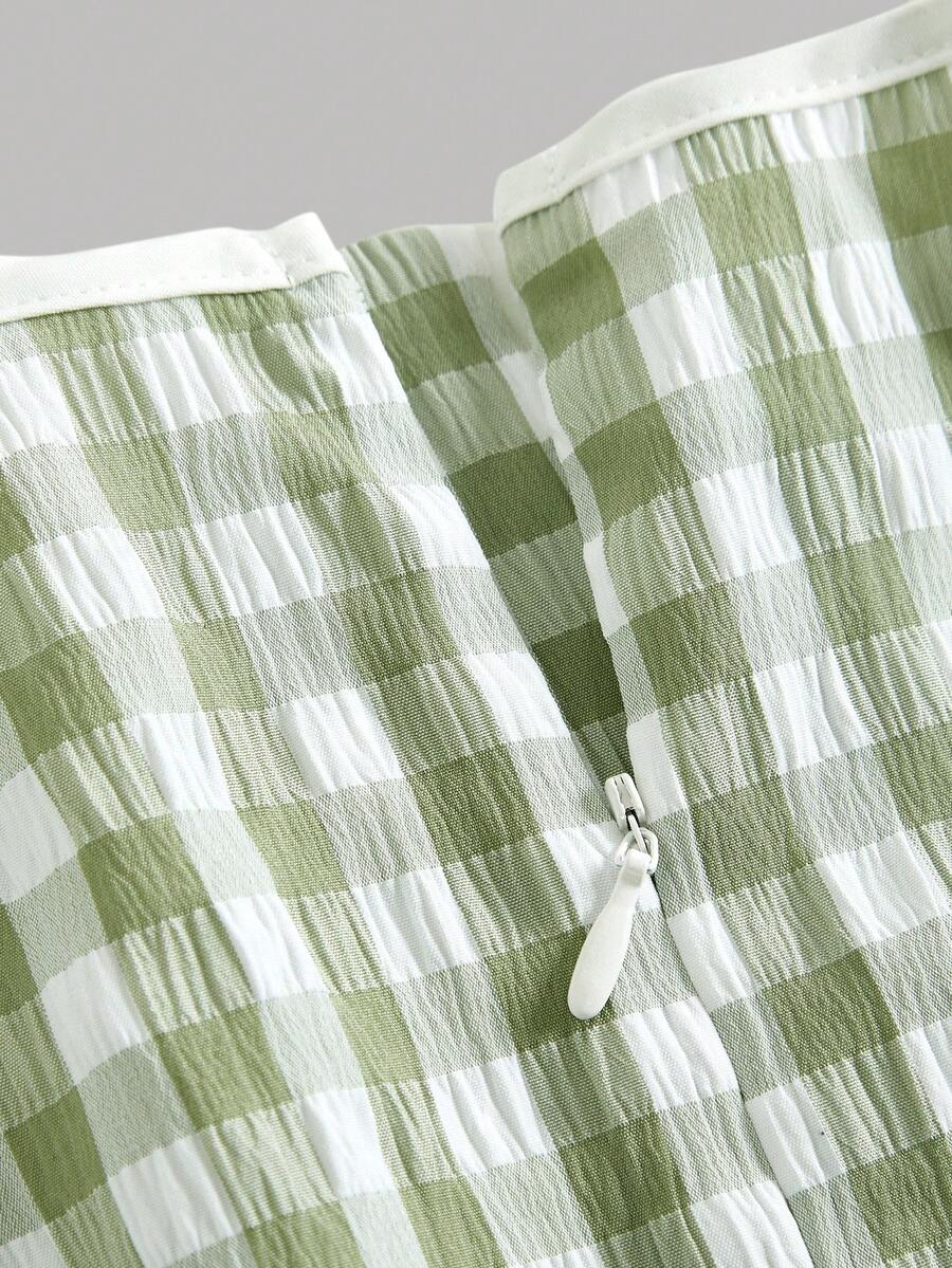 Tween girl green plaid modest sleeveless long dress featuring a round neckline, high waist, and flared A-line hem.
