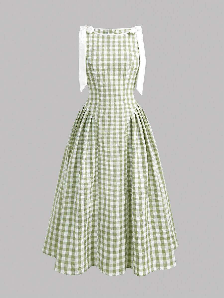 Tween girl green plaid modest sleeveless long dress featuring a round neckline, high waist, and flared A-line hem.