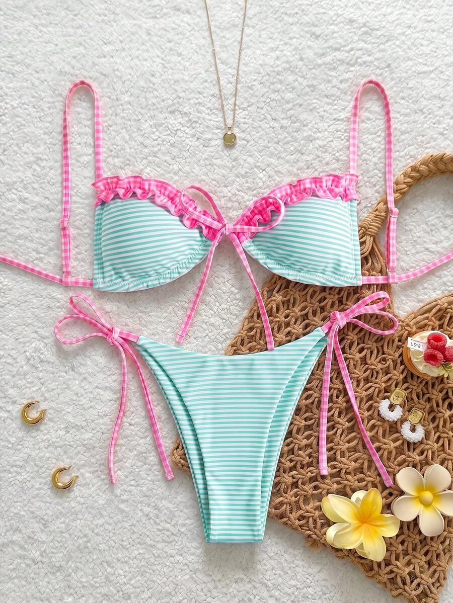 Women's beige two-piece bikini set featuring a wireless top with removable padding, spaghetti straps, tie back detail, and low waist hipster swimsuit bottoms.