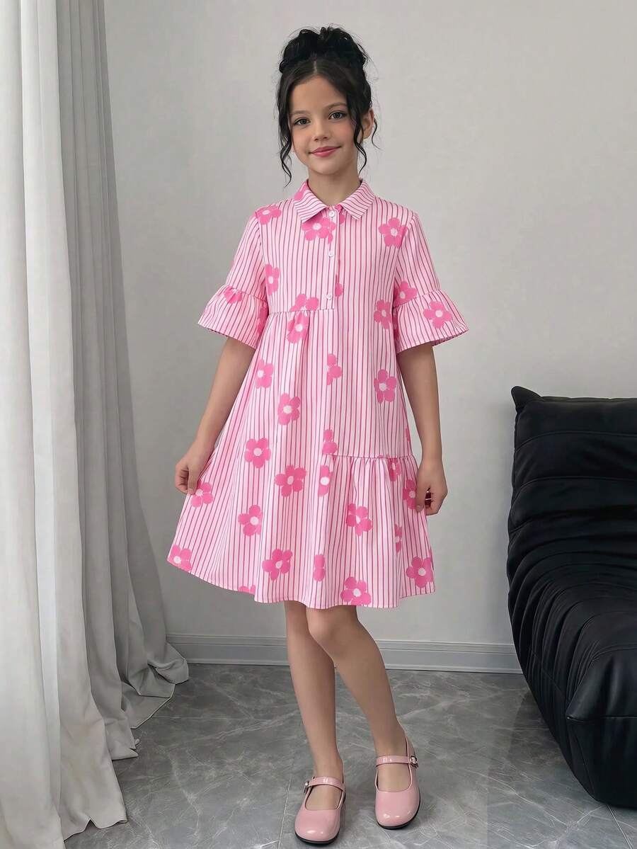 Tween girl wearing a black striped smock shirt dress with flounce half sleeves, a stand collar, and a ruffled hem.