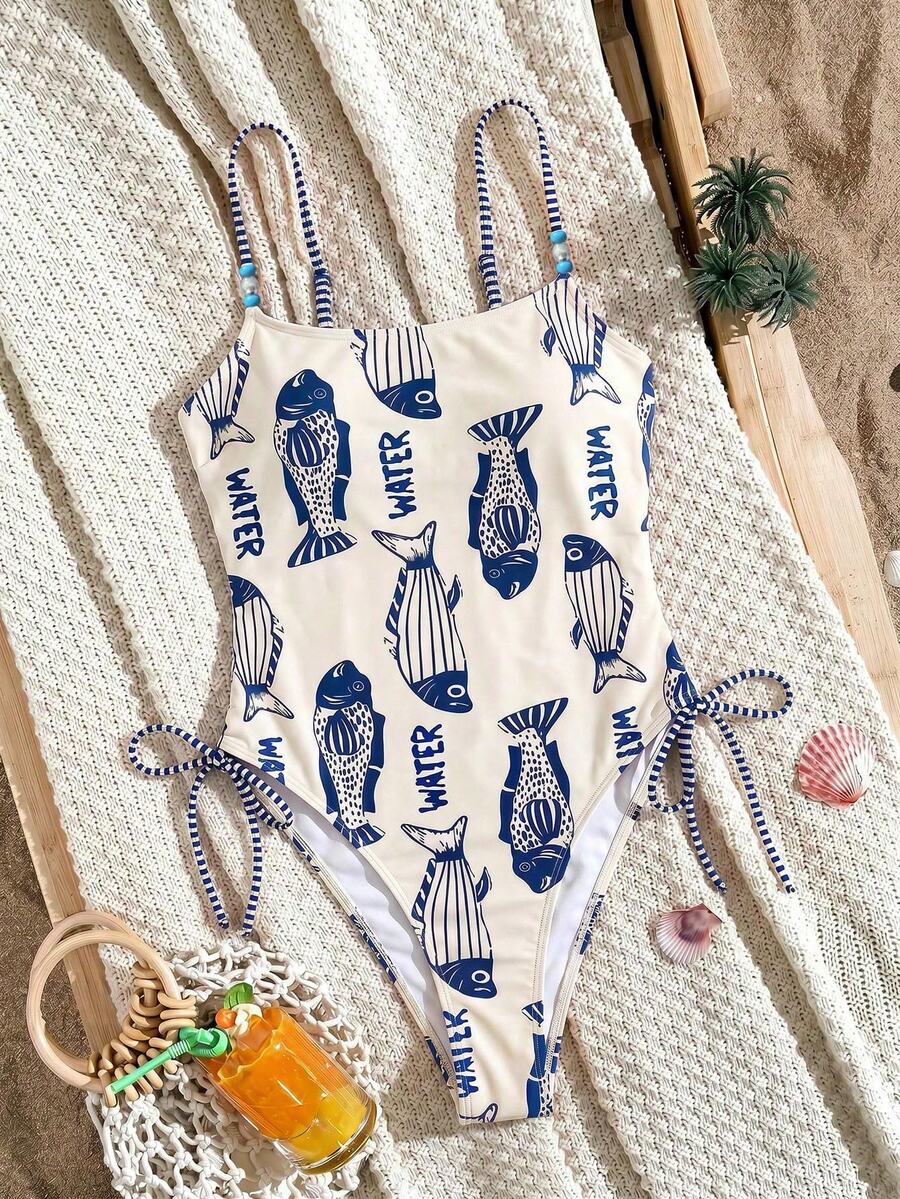 Women's blue backless one-piece swimsuit featuring spaghetti straps, wireless bra with removable padding, and drawstring details.