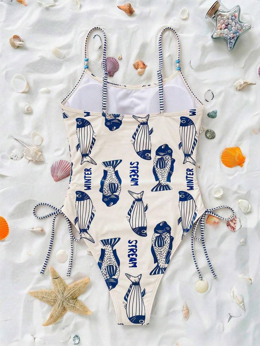 Women's blue backless one-piece swimsuit featuring spaghetti straps, wireless bra with removable padding, and drawstring details.