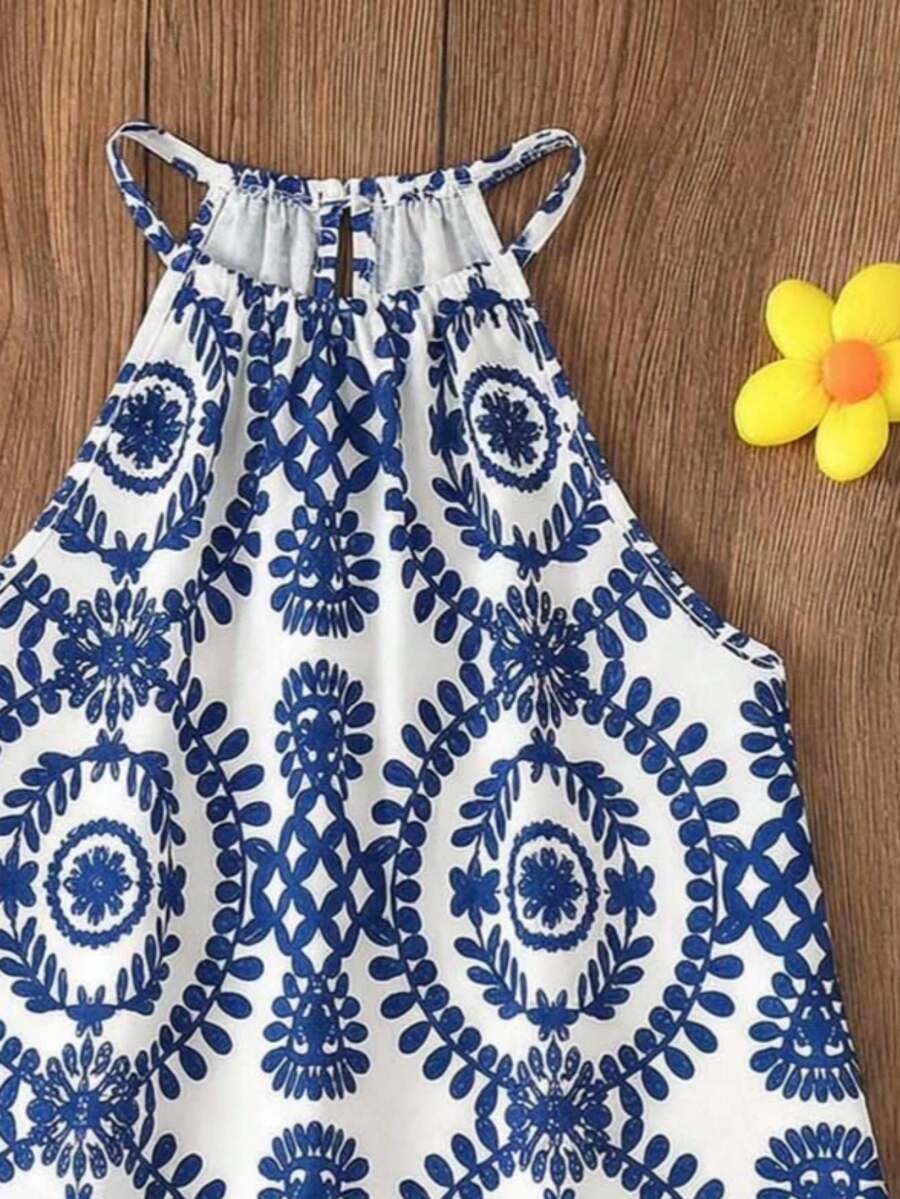 Tween girls floral halter A-line dress with contrast lace, applique and fringe details, sleeveless short length in polyester
