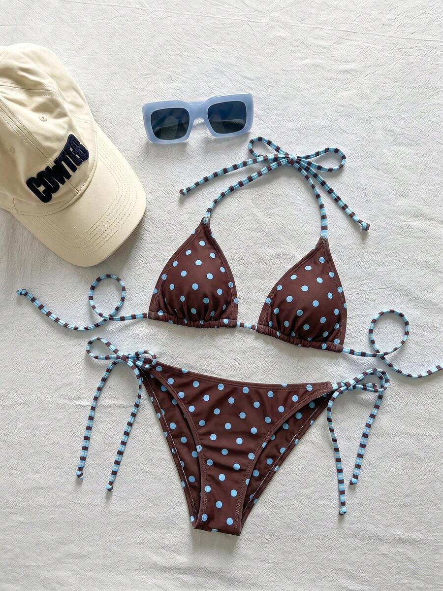 Women's black and white zebra print two-piece bikini set featuring a high waist tie-side bottom and a backless halter top with removable padding.