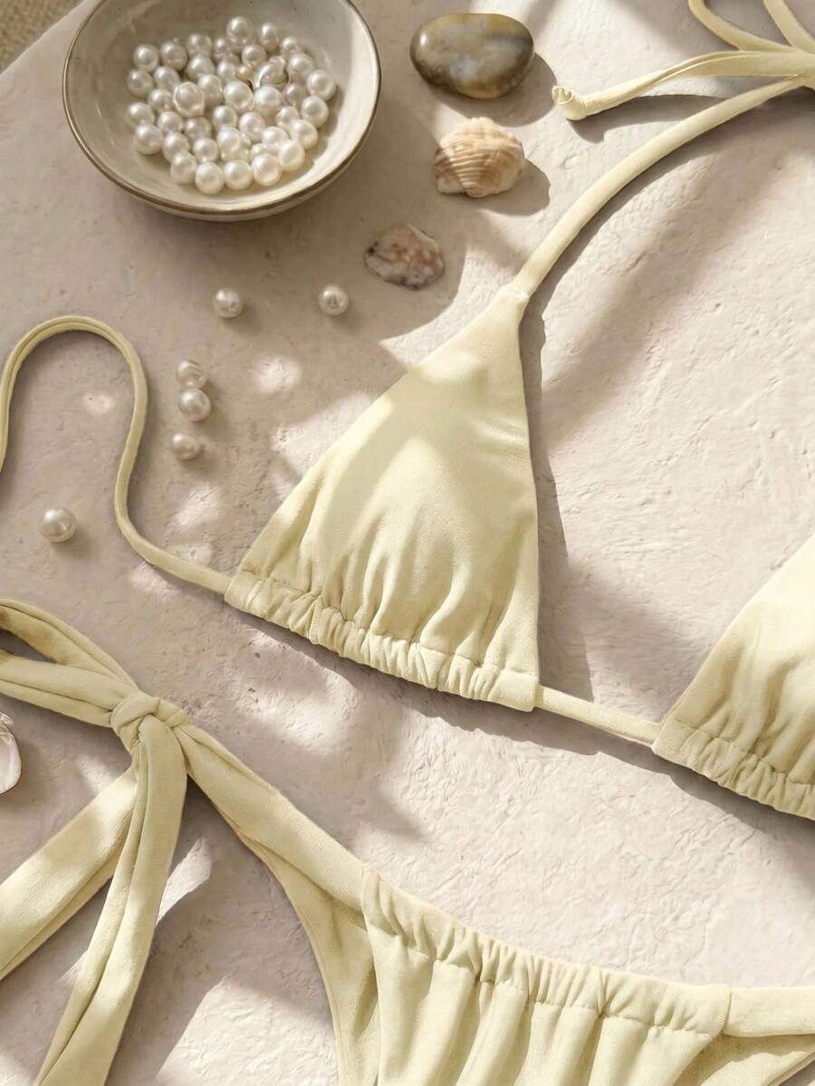 Army green high waist micro bikini swimsuit set for women featuring wireless spaghetti strap top with chain knot details and tie side thong bottoms.