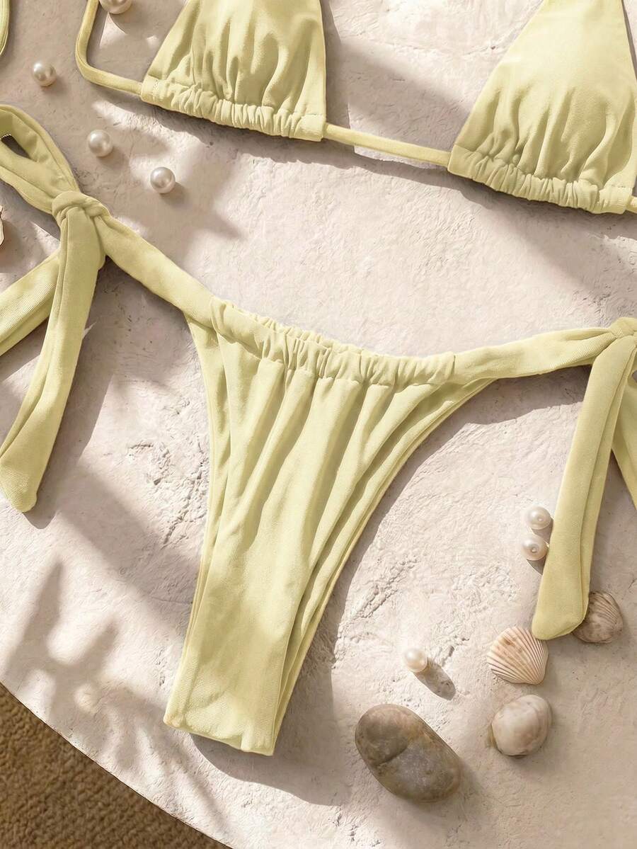 Army green high waist micro bikini swimsuit set for women featuring wireless spaghetti strap top with chain knot details and tie side thong bottoms.