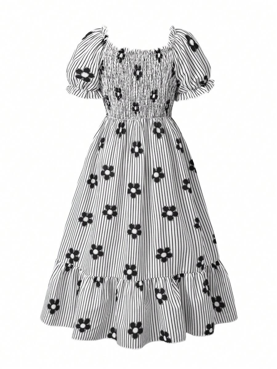 Tween girl wearing a black and white off-the-shoulder floral midi dress featuring short puff sleeves, high waist, and flounce hem.