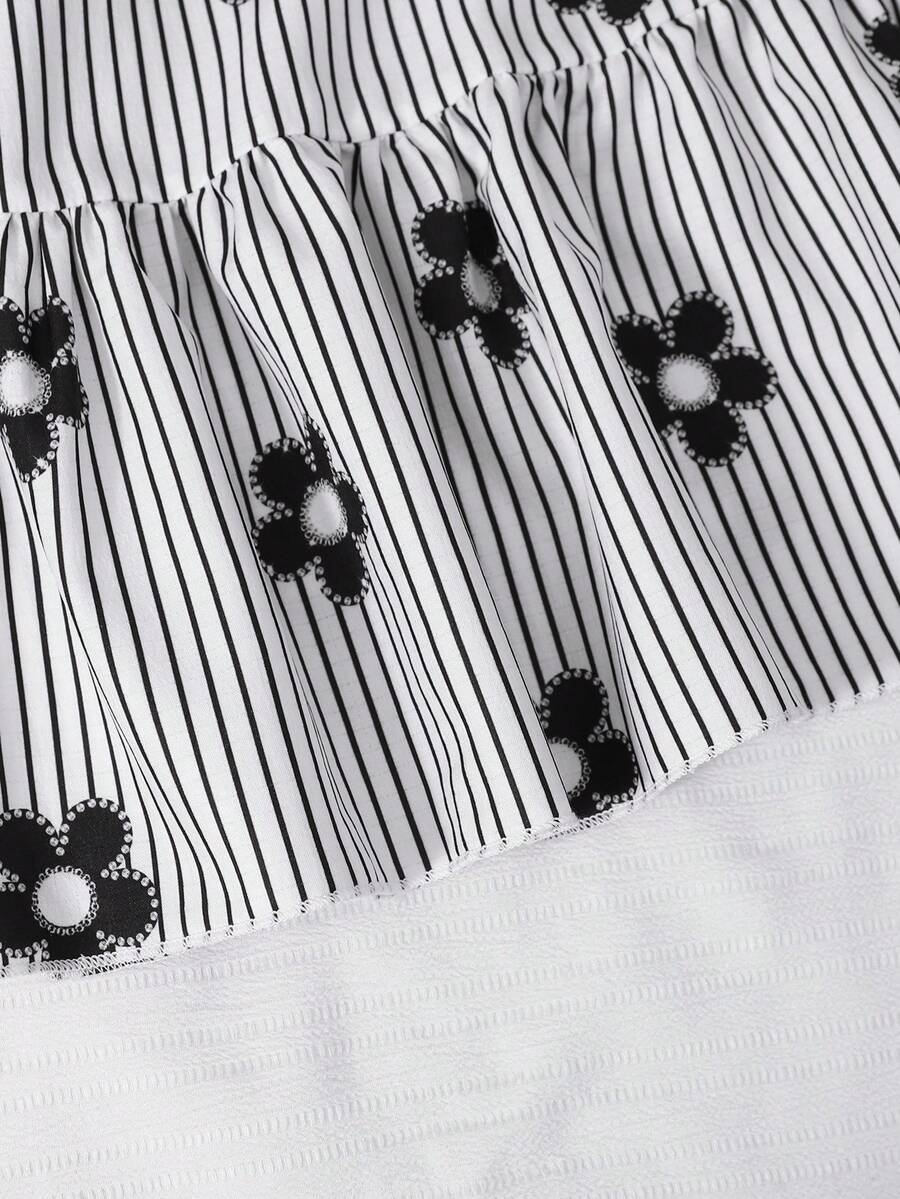 Tween girl wearing a black and white off-the-shoulder floral midi dress featuring short puff sleeves, high waist, and flounce hem.