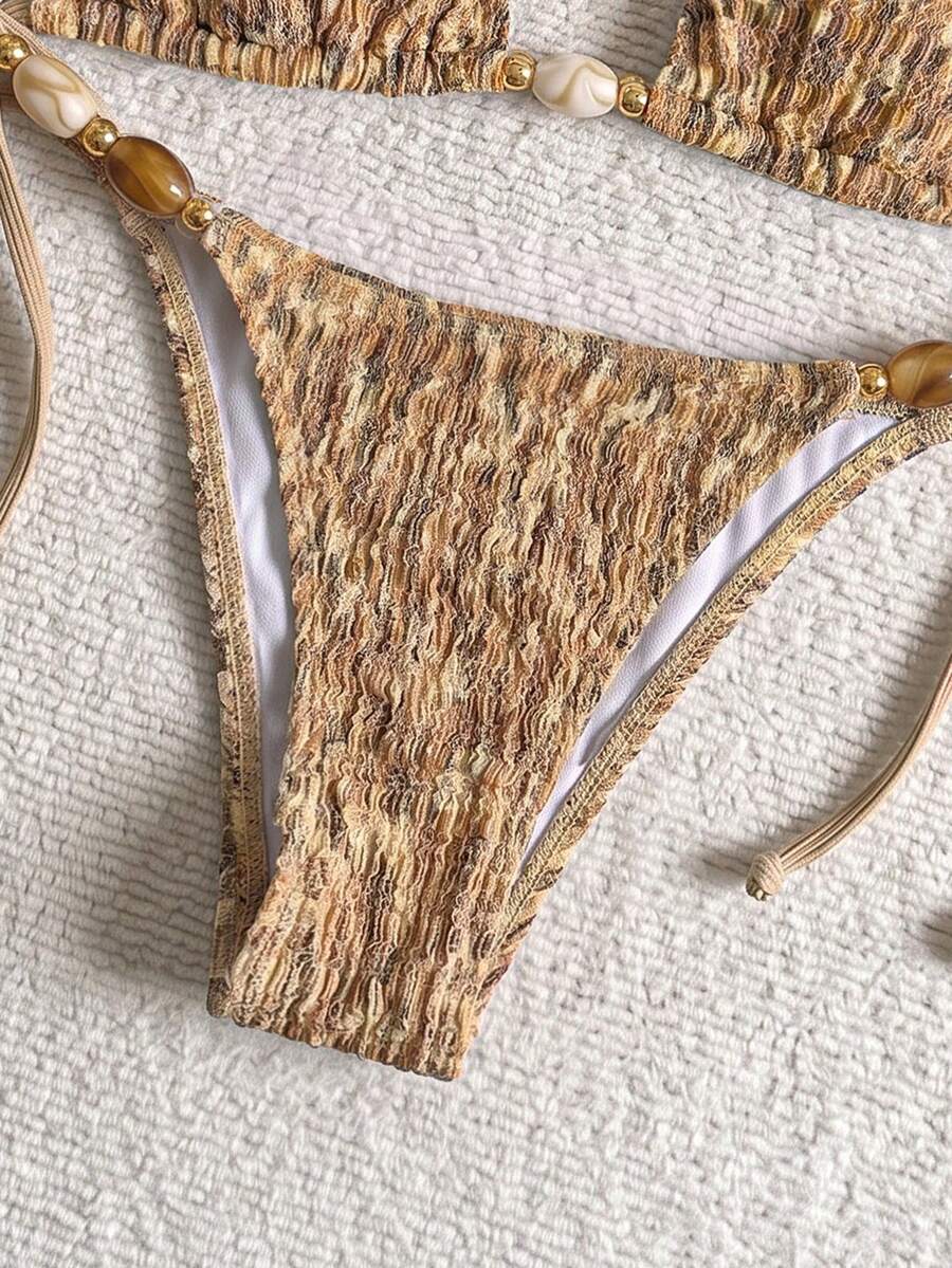 Multicolor textured beaded halter bikini set for women featuring wireless triangle cups with removable padding and ultra low waist tie side bottoms.