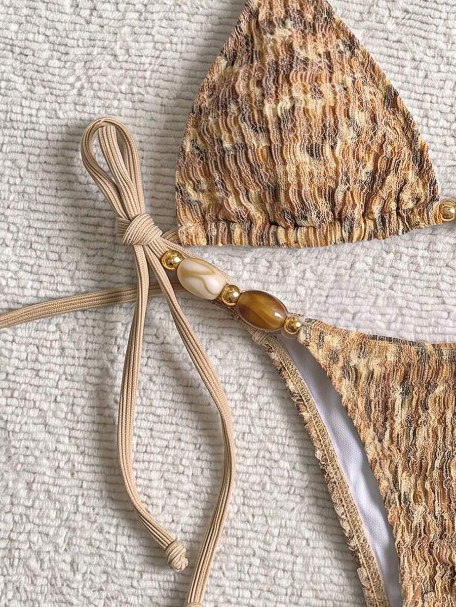 Multicolor textured beaded halter bikini set for women featuring wireless triangle cups with removable padding and ultra low waist tie side bottoms.