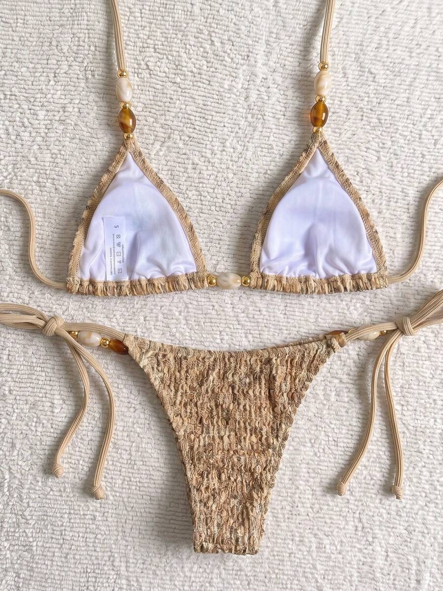 Multicolor textured beaded halter bikini set for women featuring wireless triangle cups with removable padding and ultra low waist tie side bottoms.