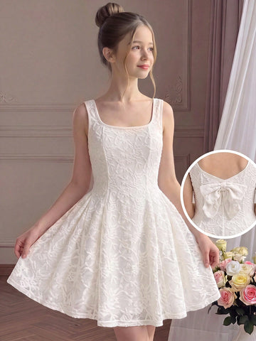 Apricot short-sleeve holiday party dress for tween girls featuring a square neckline, contrast lace details, high waist, flared A-line hem, and bowknot ruffle back detail.