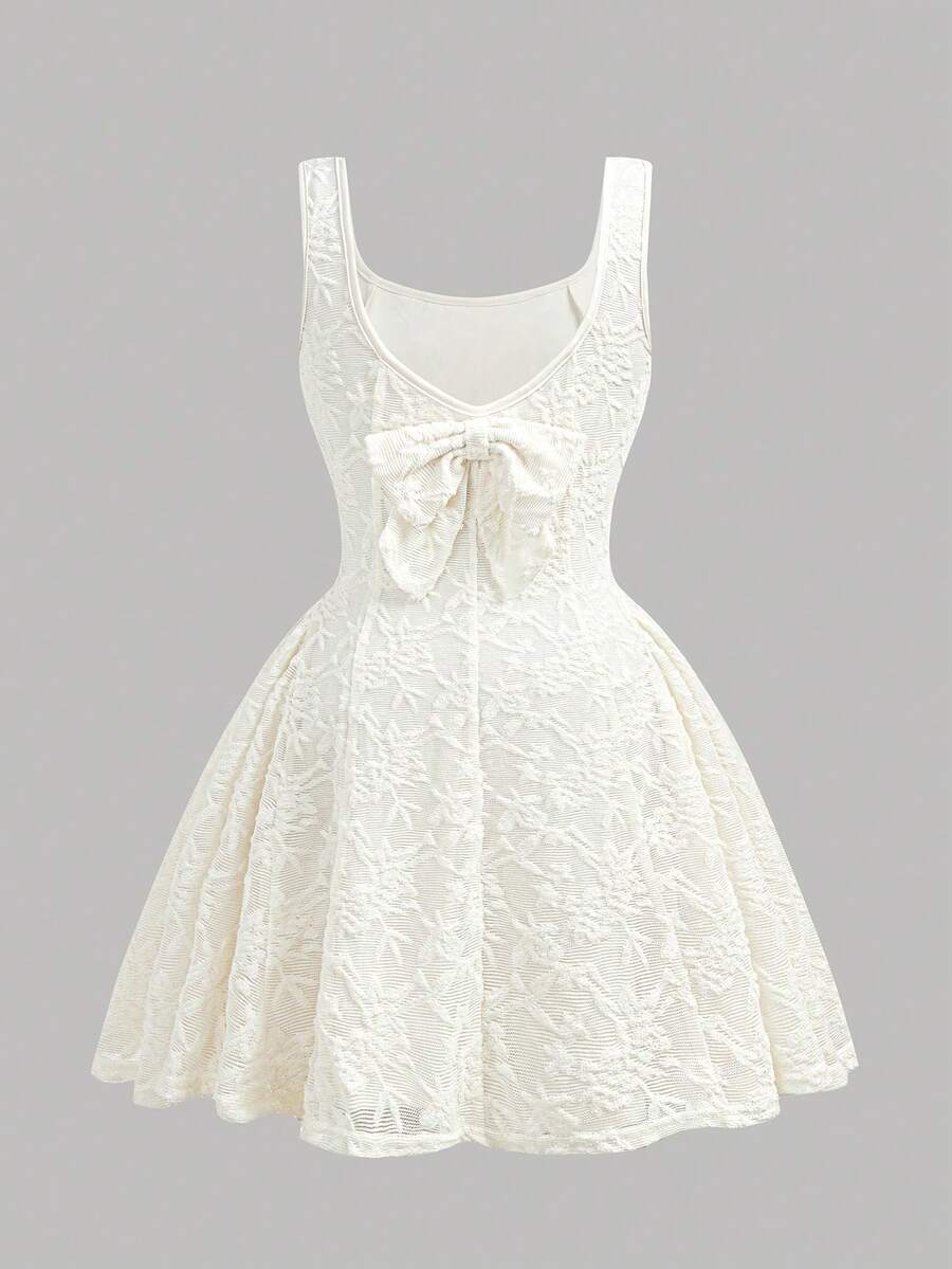 Apricot short-sleeve holiday party dress for tween girls featuring a square neckline, contrast lace details, high waist, flared A-line hem, and bowknot ruffle back detail.