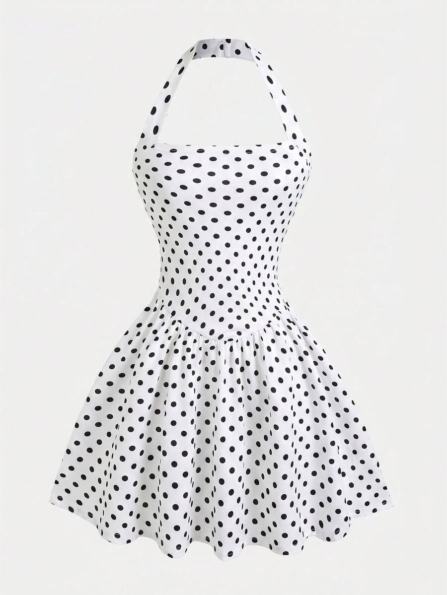 Black sleeveless halter polka dot mini dress for tween girls featuring a high waist and flared hem
