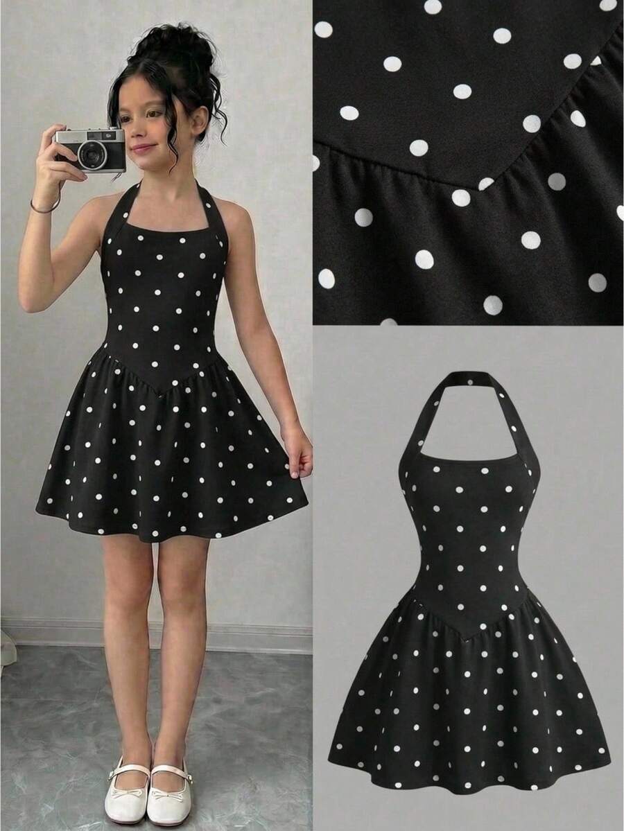 Black sleeveless halter polka dot mini dress for tween girls featuring a high waist and flared hem