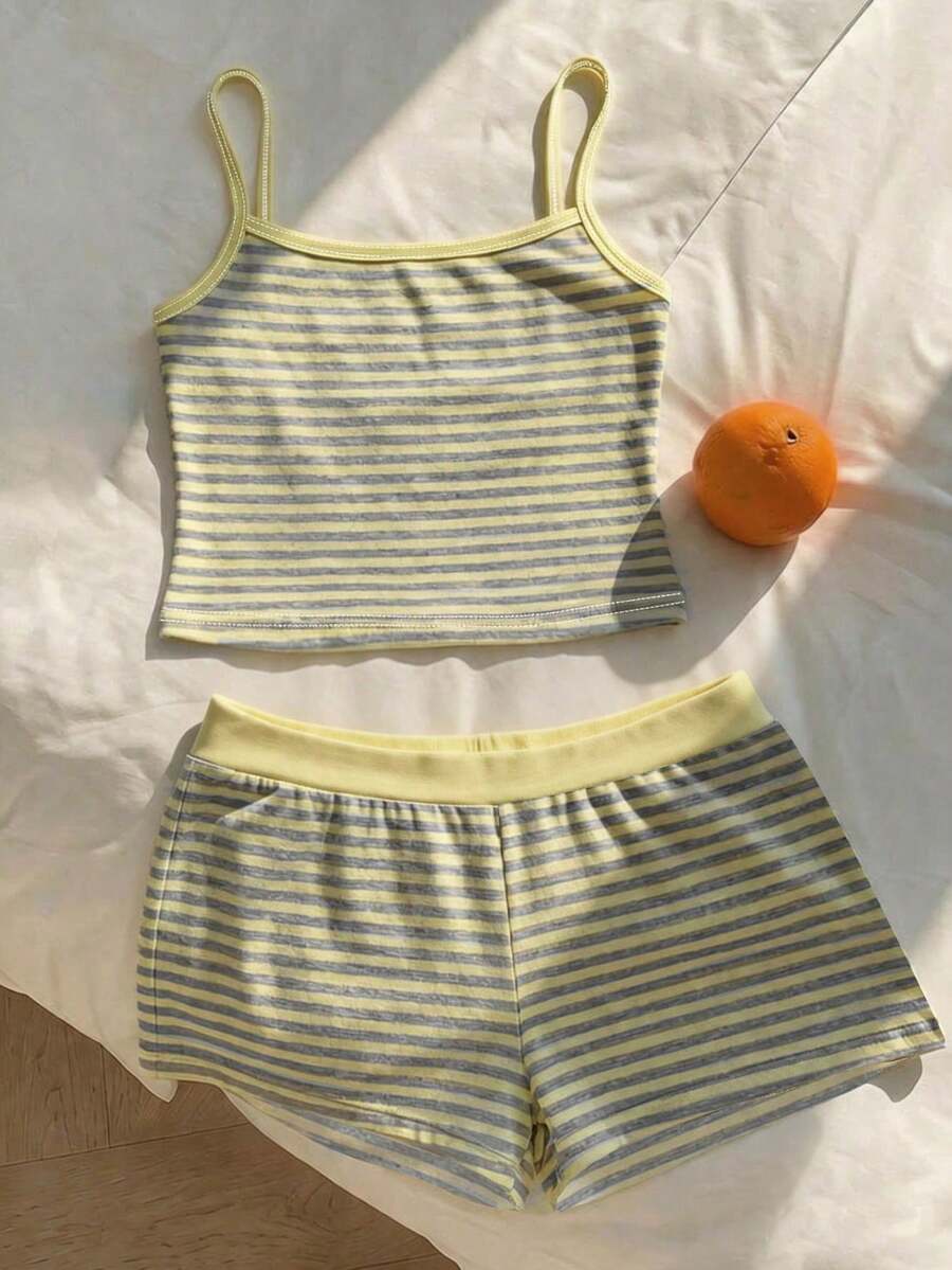 Tween girls summer 2-piece Hawaiian style outfit featuring a graphic print spaghetti strap camisole top with contrast piping and matching casual shorts.
