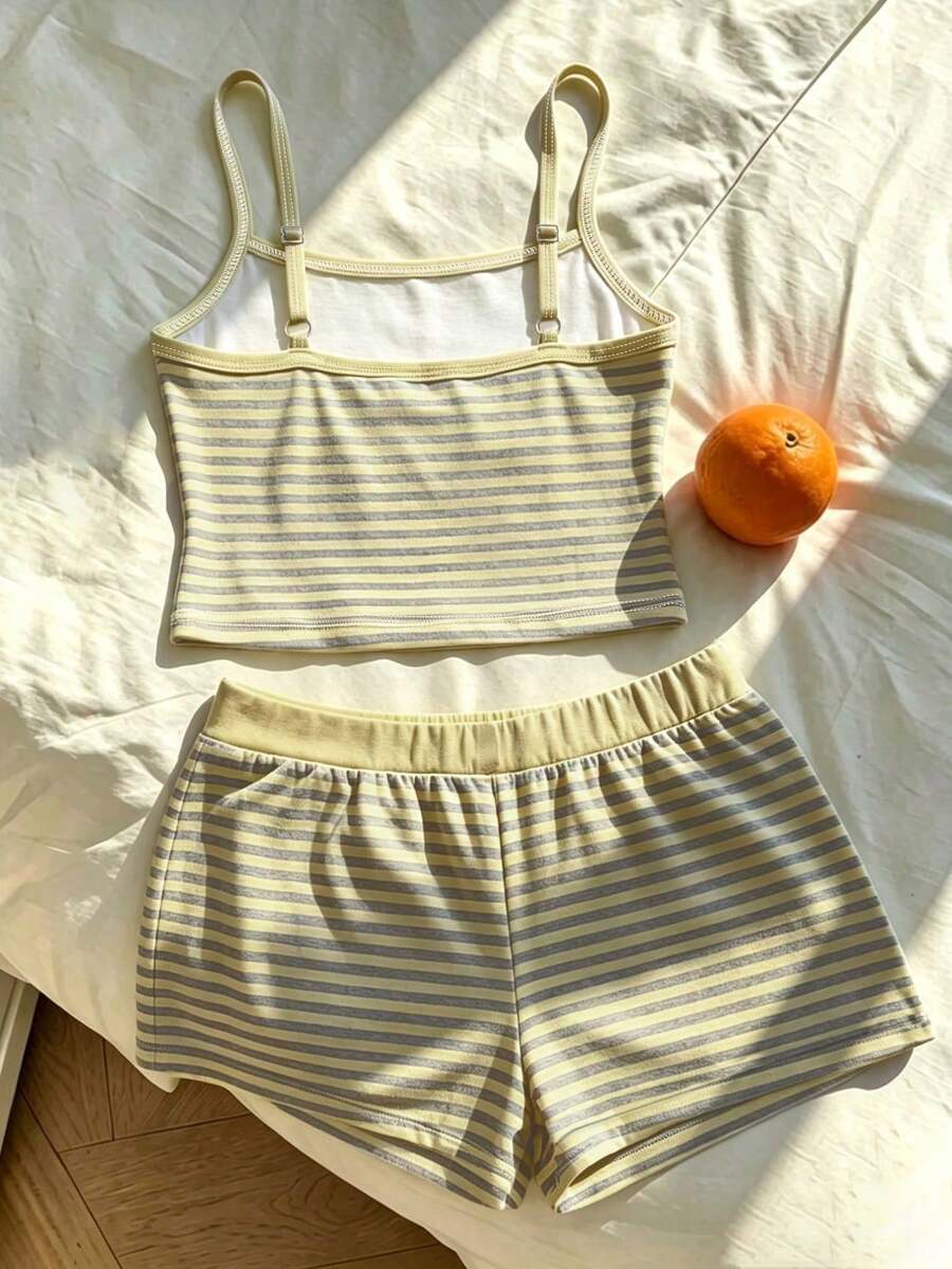 Tween girls summer 2-piece Hawaiian style outfit featuring a graphic print spaghetti strap camisole top with contrast piping and matching casual shorts.
