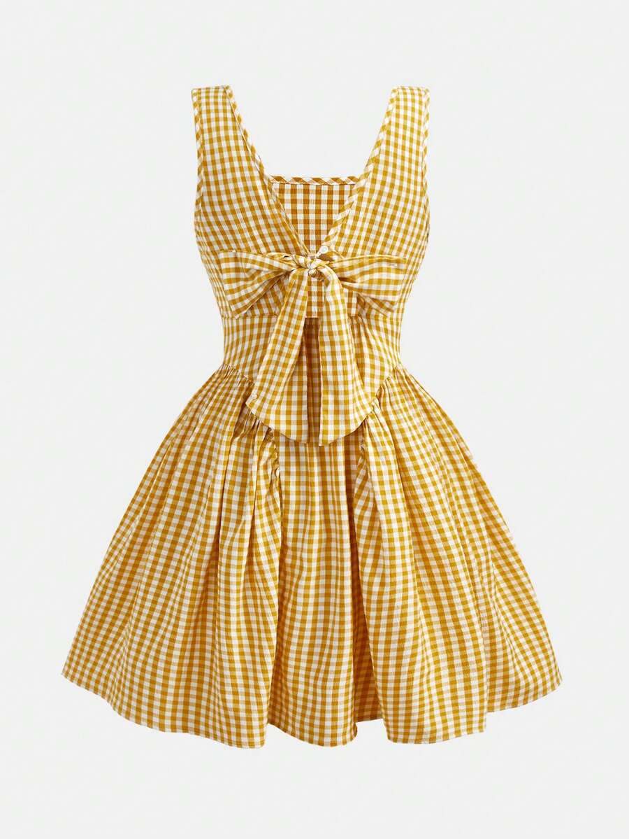 Black and white polka dot sleeveless A-line dress for tween girls featuring a scoop neck, high waist, and flared hem.
