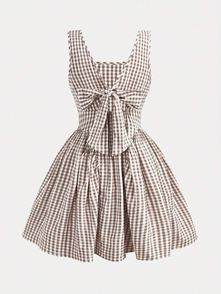Black and white polka dot sleeveless A-line dress for tween girls featuring a scoop neck, high waist, and flared hem.
