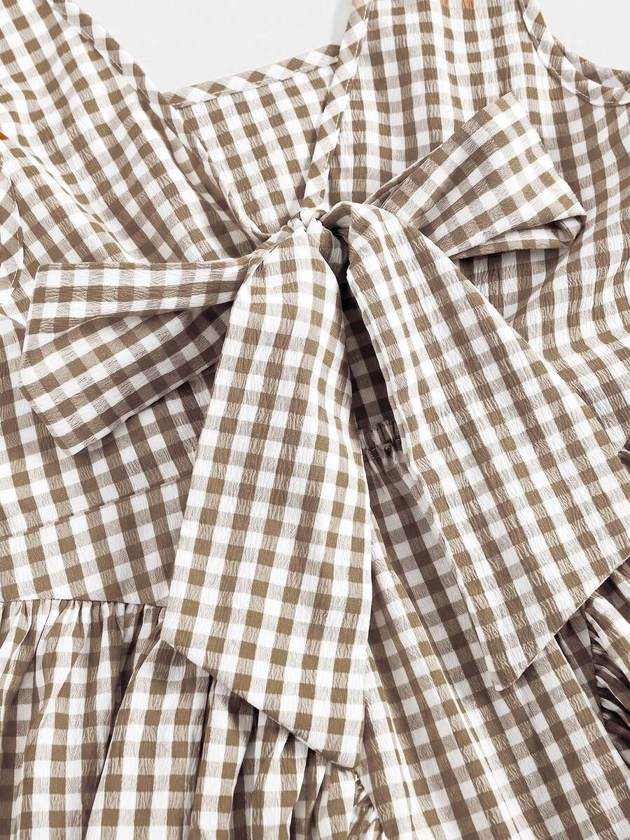 Black and white polka dot sleeveless A-line dress for tween girls featuring a scoop neck, high waist, and flared hem.