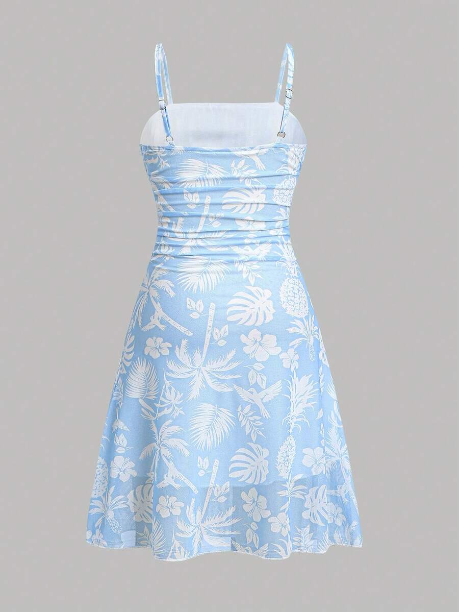 Yellow sleeveless tween girls cami dress with spaghetti straps, ruched bust, shirred details, high waist, and flared short A-line hem for vacation wear.