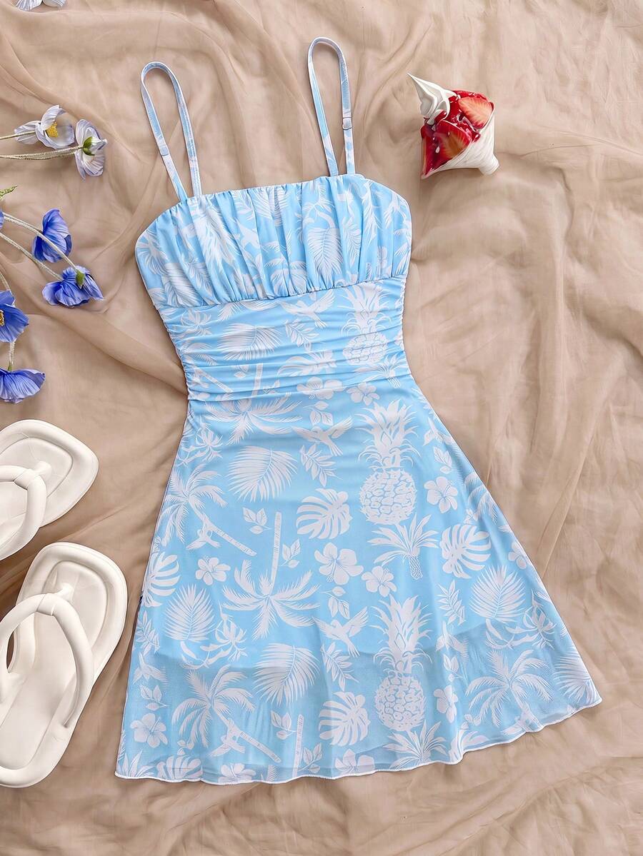 Yellow sleeveless tween girls cami dress with spaghetti straps, ruched bust, shirred details, high waist, and flared short A-line hem for vacation wear.