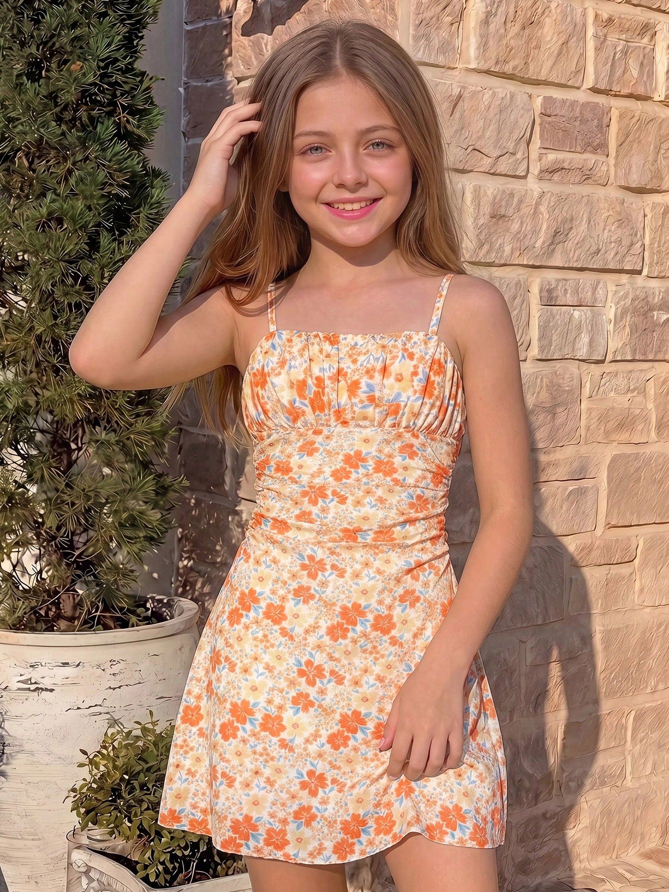 Yellow sleeveless tween girls cami dress with spaghetti straps, ruched bust, shirred details, high waist, and flared short A-line hem for vacation wear.