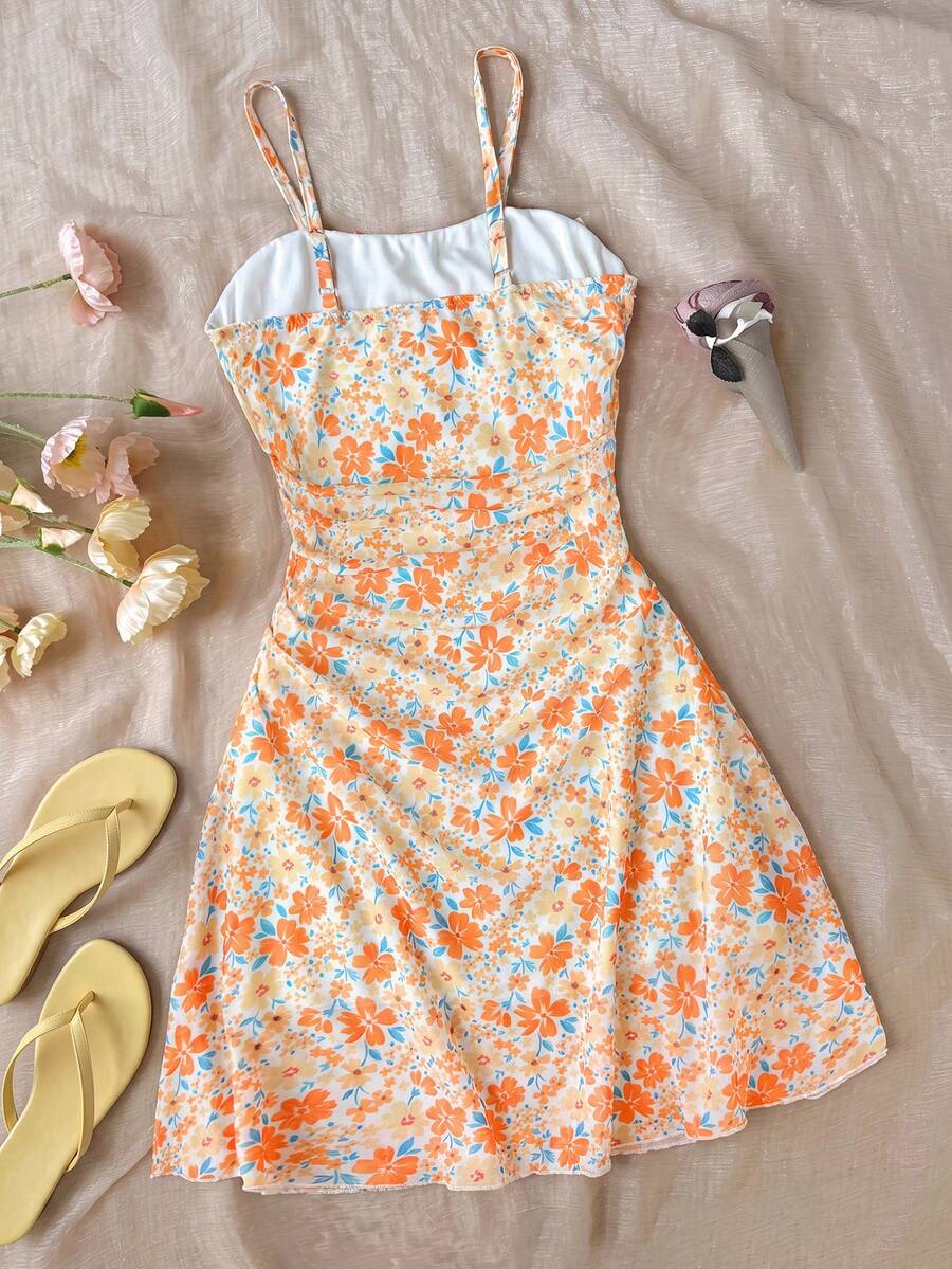 Yellow sleeveless tween girls cami dress with spaghetti straps, ruched bust, shirred details, high waist, and flared short A-line hem for vacation wear.