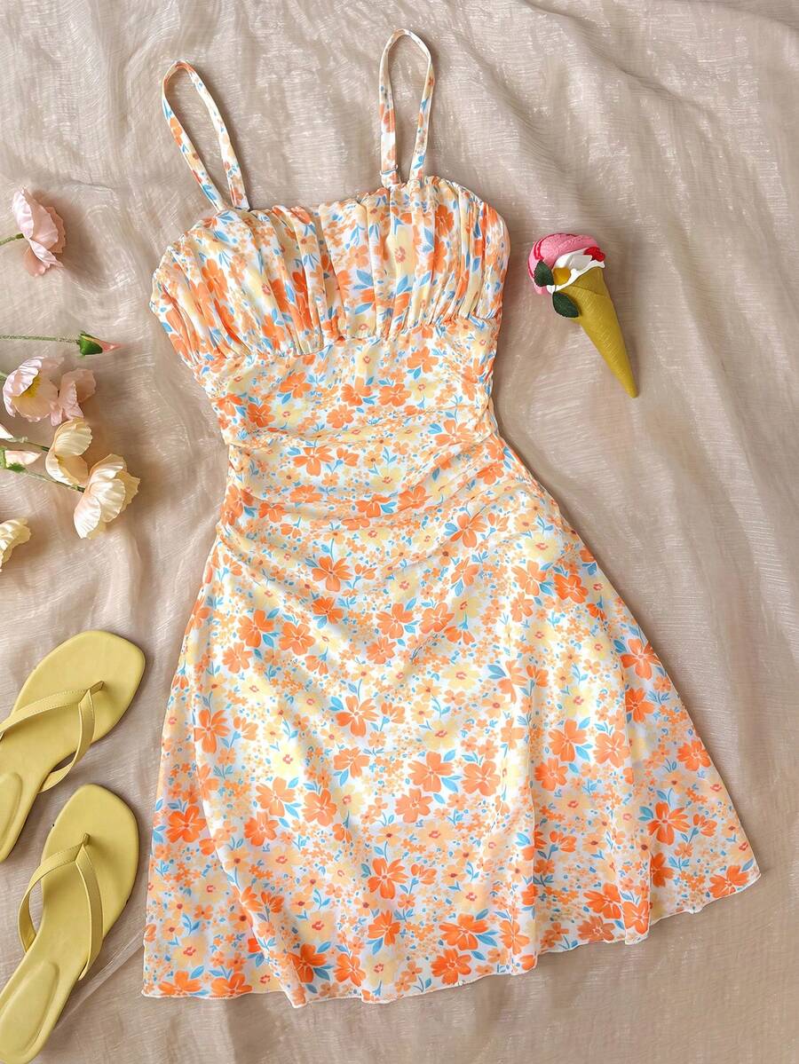 Yellow sleeveless tween girls cami dress with spaghetti straps, ruched bust, shirred details, high waist, and flared short A-line hem for vacation wear.