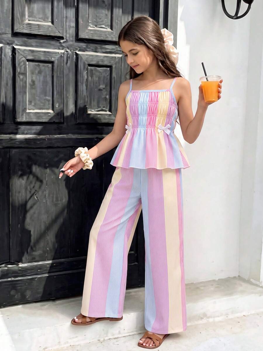 Girls 2-piece summer outfit set featuring a blue bow print camisole top with spaghetti straps and matching high-waisted straight leg pants.