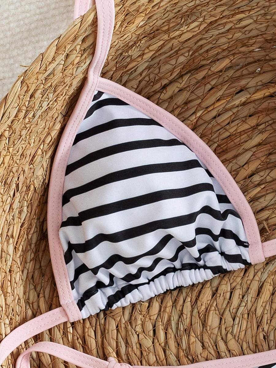 Women's two-piece halter triangle bikini set featuring a backless tie-back top with removable padding and matching tie-side mid-waist bottoms.