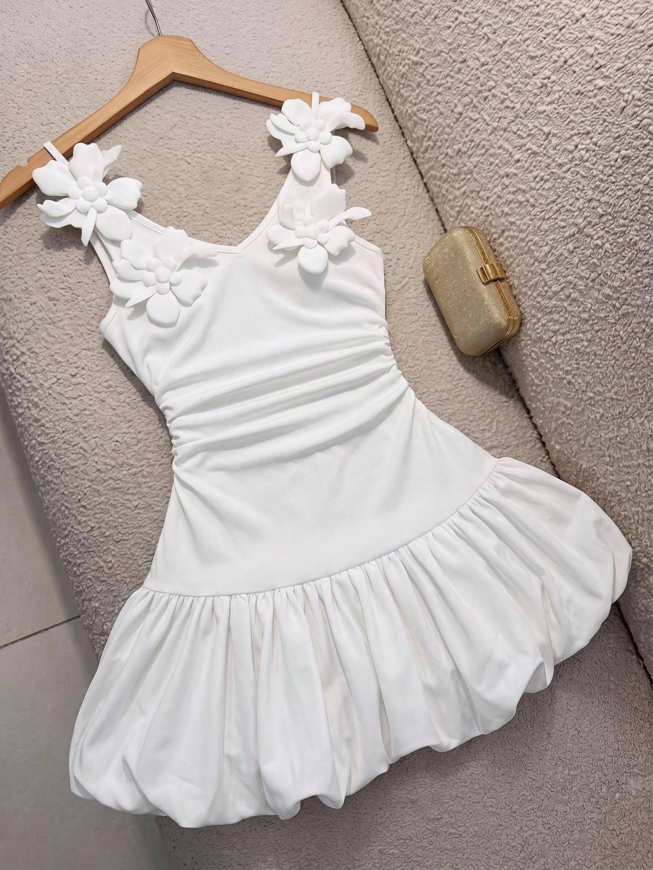 Black and white polka dot cami dress for tween girls featuring a square neckline, high waist, and flared short A-line hem.