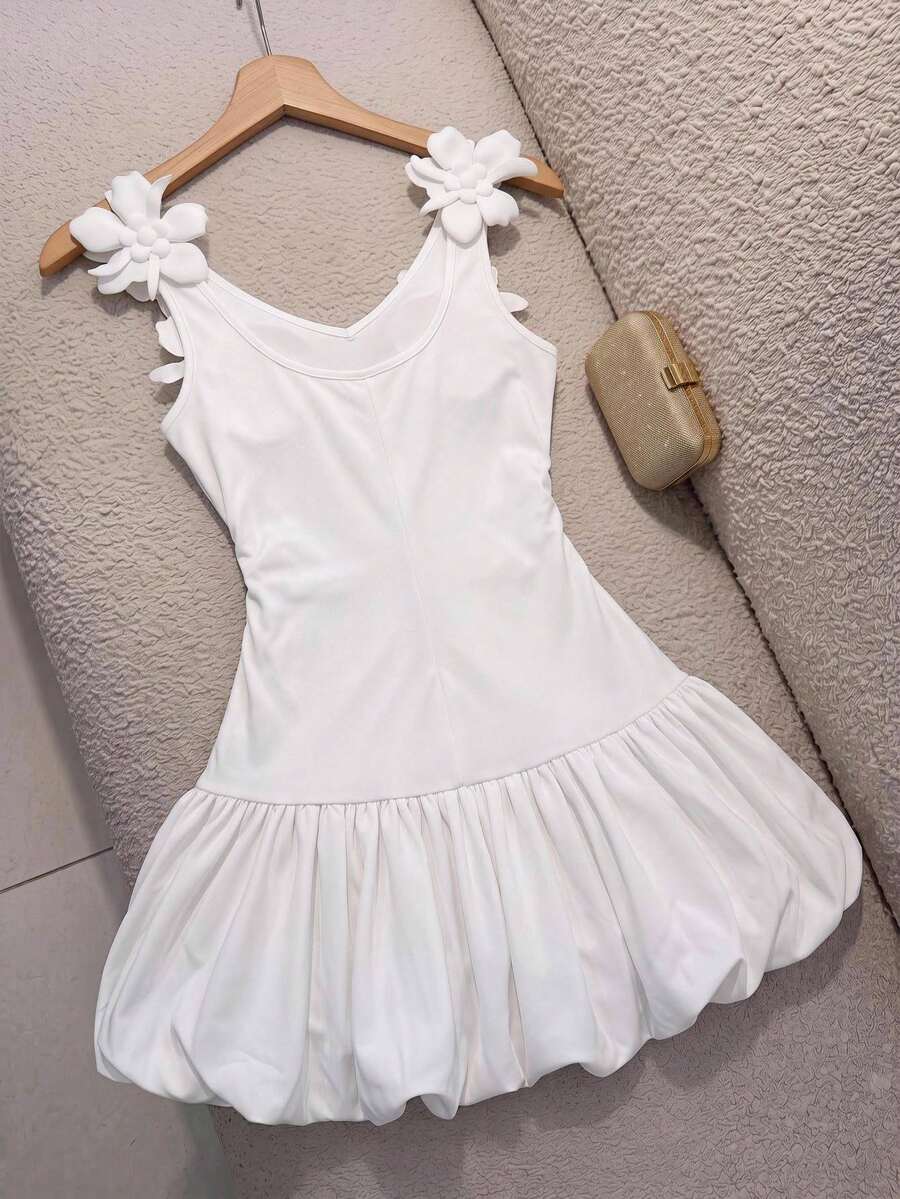 Black and white polka dot cami dress for tween girls featuring a square neckline, high waist, and flared short A-line hem.