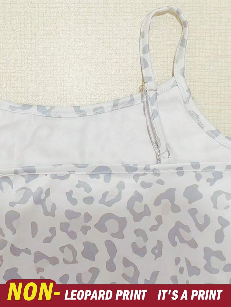 Tween girls summer 2-piece Hawaiian style outfit featuring a graphic print spaghetti strap camisole top with contrast piping and matching casual shorts.