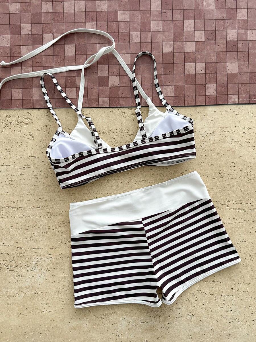 Women's retro pink and blue cartoon sardine print halter two-piece swimwear featuring a high waist shorts bottom and wireless bra with removable padding.