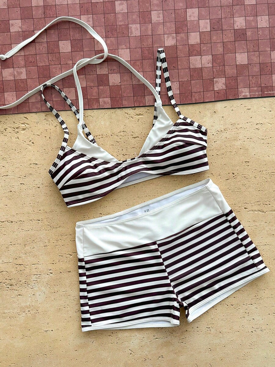 Women's retro pink and blue cartoon sardine print halter two-piece swimwear featuring a high waist shorts bottom and wireless bra with removable padding.