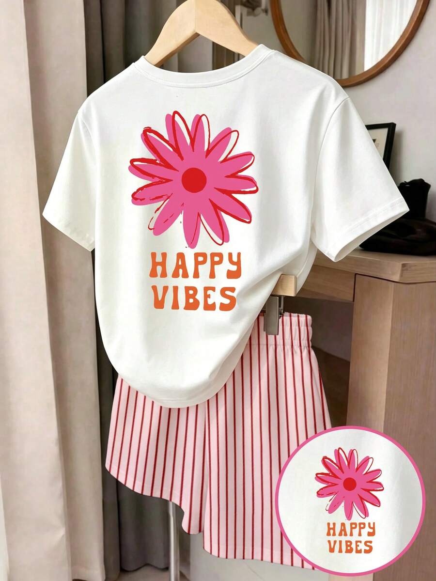 Girls' multicolor short sleeve T-shirt and shorts set featuring a cute cherry and bow print with round neck top and matching shorts.