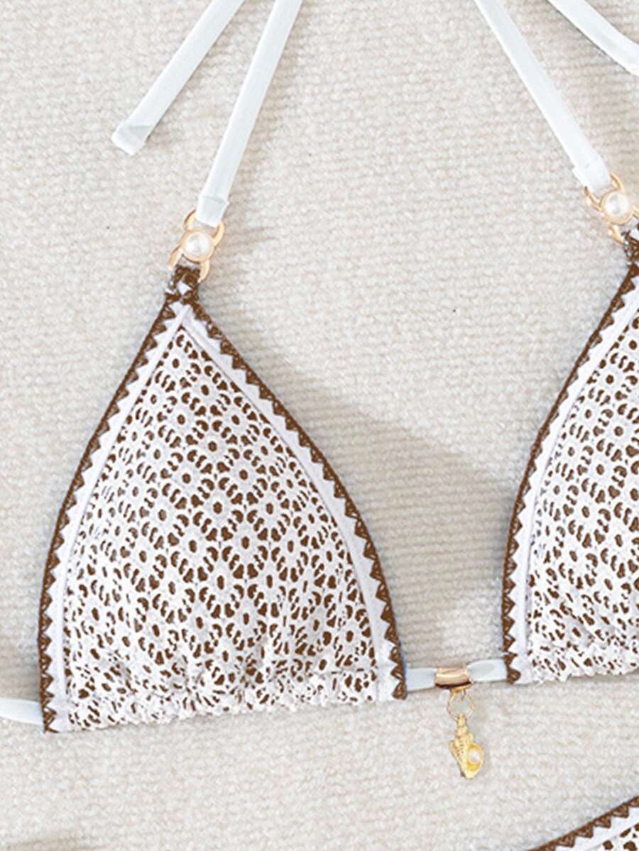 Women's triangle bikini set with contrast lace wireless bra top and ultra high waist tie side bottoms.
