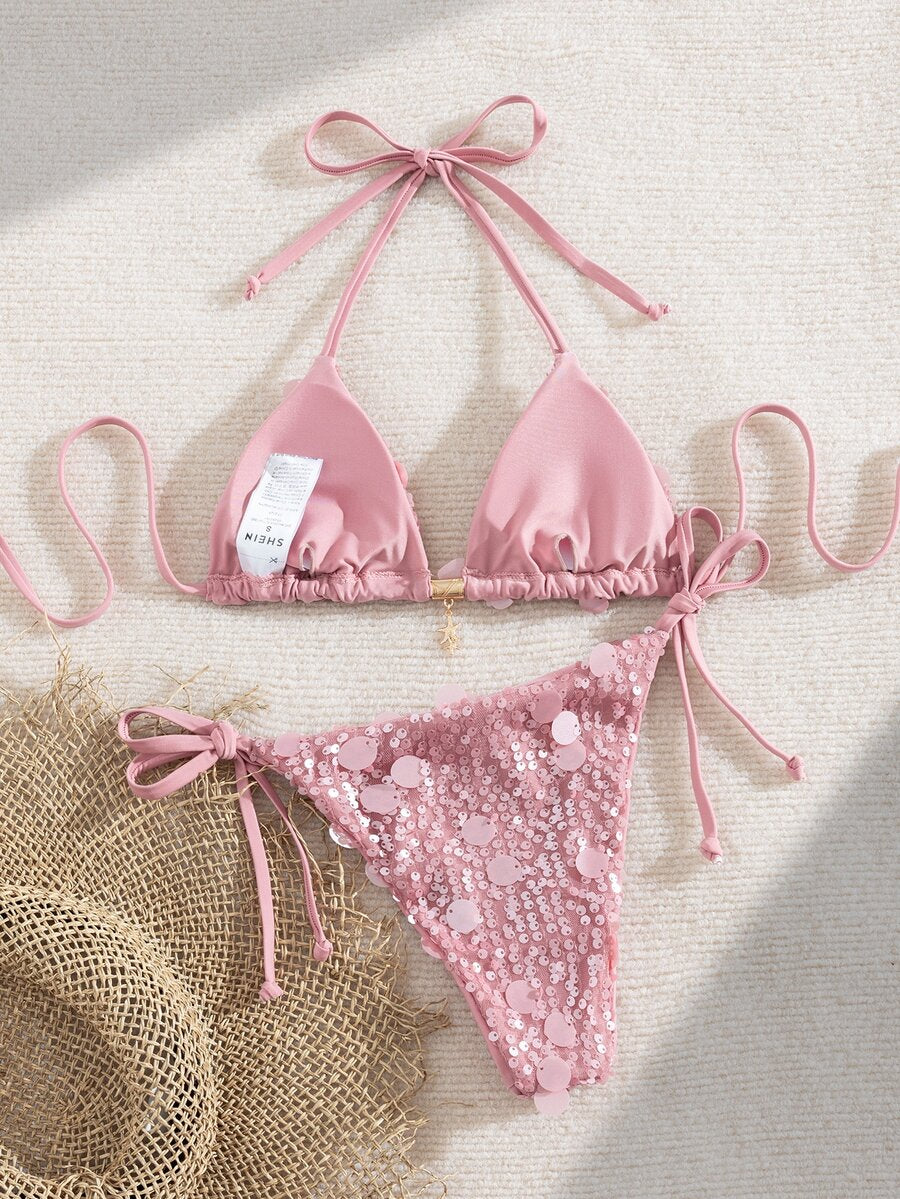 Beige Y2K triangle bikini set featuring a deep V-neck halter top with knot details and removable padding paired with low waist cheeky bottoms.