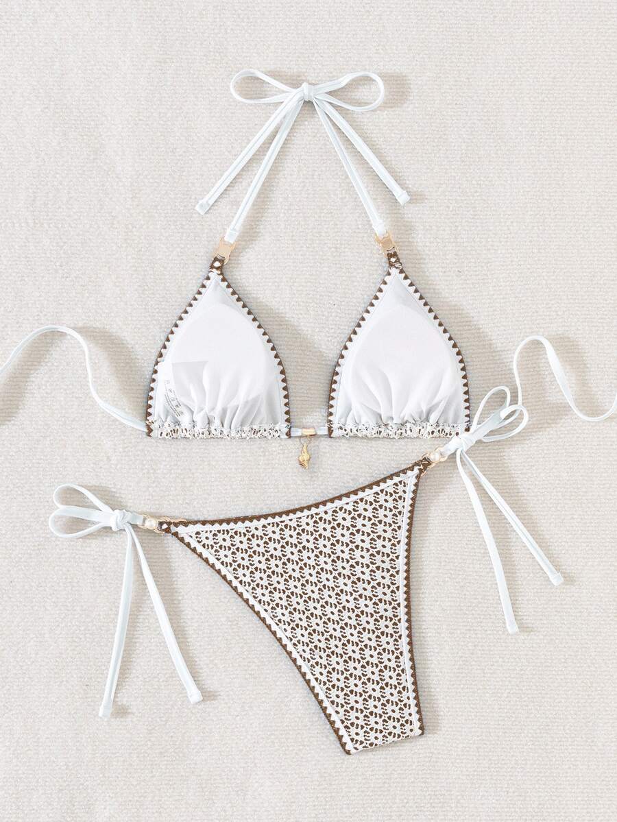 Women's triangle bikini set with contrast lace wireless bra top and ultra high waist tie side bottoms.
