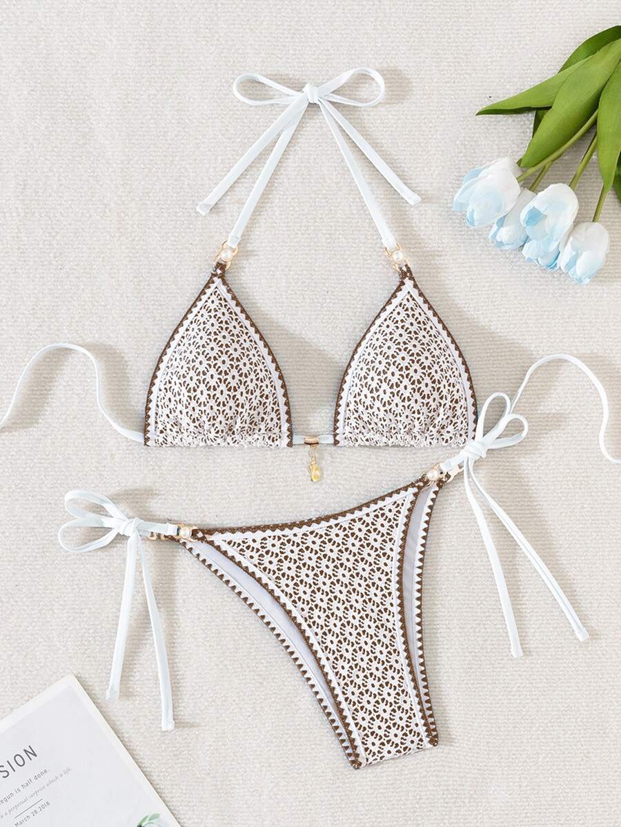 Women's triangle bikini set with contrast lace wireless bra top and ultra high waist tie side bottoms.