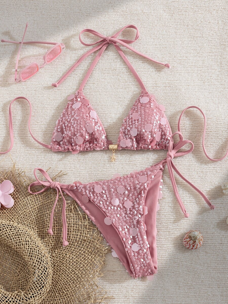 Beige Y2K triangle bikini set featuring a deep V-neck halter top with knot details and removable padding paired with low waist cheeky bottoms.