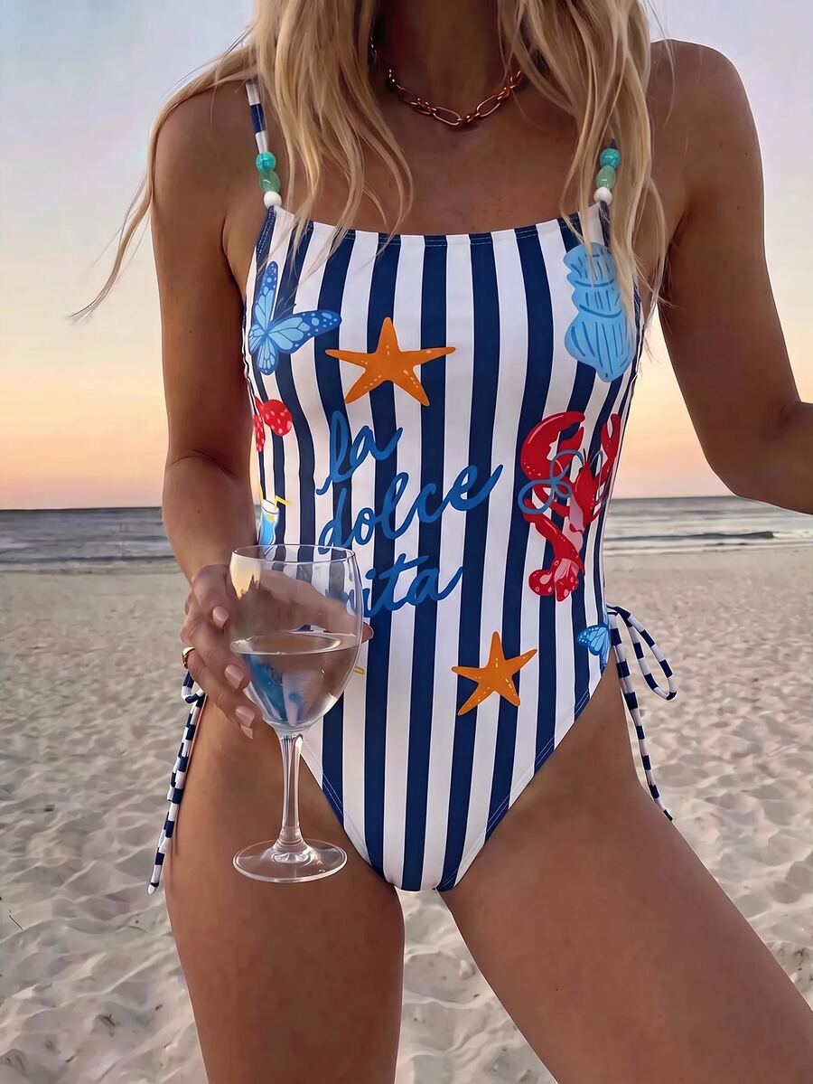 Women's blue backless one-piece swimsuit featuring spaghetti straps, wireless bra with removable padding, and drawstring details.